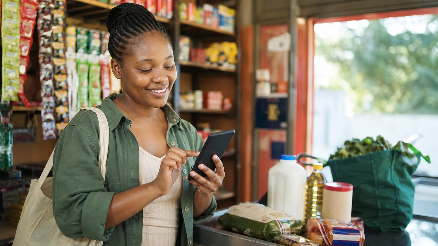 Customer using a smartphone while shopping